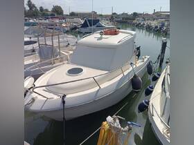 A well-maintained boat docked at the marina, showcasing its sleek design and readiness for the water.