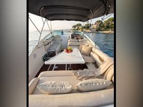 A beautifully arranged interior of a boat featuring plush seating and a dining area, perfect for relaxing and enjoying scenic views on the water.