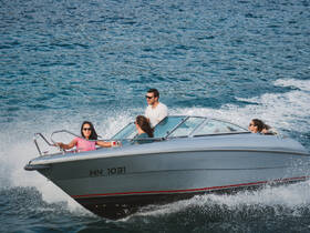 A lively group enjoys a thrilling ride on a speedboat, capturing the excitement of on-water adventures with friends.