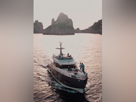 A lively group enjoys a day on a luxurious yacht, cruising through stunning coastal scenery — perfect for celebrations and unforgettable experiences on the water.