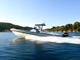 A sleek speedboat glides through the water, showcasing its dynamic design and performance. Perfect for thrilling adventures on the open sea.