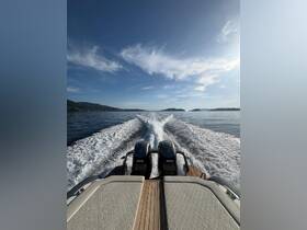 A stunning view from the back of a speedboat, showcasing the powerful twin engines and a serene waterway, perfect for thrilling adventures on the open sea.