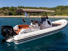 A sleek Italboats speedboat anchored in clear waters, showcasing its modern design and spacious seating — perfect for exploring coastal destinations.