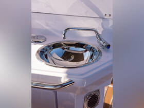 Close-up of a polished stainless steel sink on a boat, showcasing essential onboard amenities for convenience and comfort.
