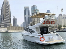 A sleek yacht docked in a vibrant urban setting, showcasing modern architecture in the background — perfect for luxury charters and city tours.