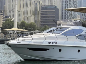 A sleek yacht docked in a vibrant urban marina, showcasing modern architecture in the background — perfect for luxury outings and city tours.