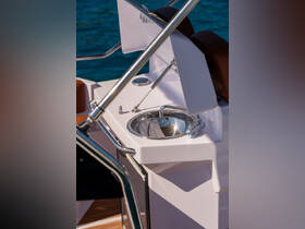 A close-up view of a sleek sink on a boat, showcasing modern amenities designed for convenience while on the water.