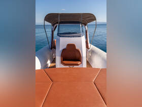 A stylish interior view of a boat's helm and seating area, showcasing modern design and comfort for an enjoyable boating experience.