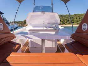 A beautifully designed interior view of a boat's helm and seating area, showcasing modern amenities and comfortable seating, perfect for a day on the water.