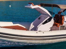 A close-up view of a sleek speedboat with an open helm, showcasing its modern design and inviting seating, perfect for a day on the water.