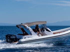 A sleek Italboats speedboat glides through the clear waters, showcasing an exciting day on the sea with friends at the helm.