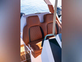 A stylish interior shot showcasing the luxurious seating and helm area of a modern boat, perfect for comfortable cruising on the water.