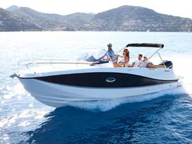 A lively group enjoys a day out on the water aboard a sleek boat, perfect for cruising and creating unforgettable memories.