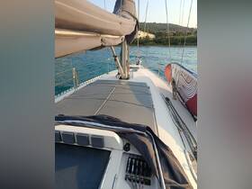 A detailed view of the helm area on a sailboat, showcasing the console and seating, perfect for navigating the open waters.