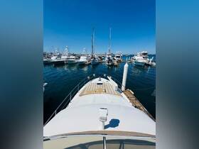 A stunning aerial view of a yacht docked in a bustling marina, showcasing the vibrant atmosphere and numerous vessels surrounding it.