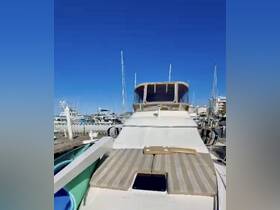 A clear view of a yacht docked at the marina, showcasing its sleek design and spacious deck — perfect for luxury outings on the water.