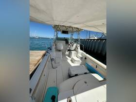 Interior view of a boat's helm and seating area, showcasing a spacious layout ideal for comfortable cruising and relaxation on the water.