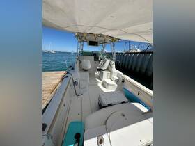 Interior view of a boat's helm and seating area, showcasing the spacious layout and amenities available for a comfortable boating experience.