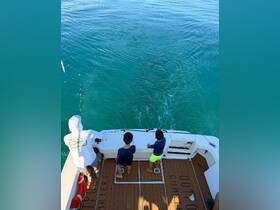 A fun fishing experience with two children on a boat, enjoying the ocean and learning the art of fishing — perfect for family adventures on the water.