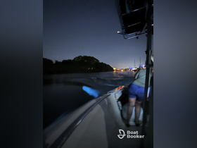 A nighttime boating experience captures the thrill of navigating through illuminated waterways, showcasing the excitement of evening adventures on the water.