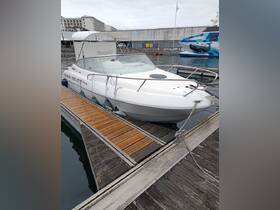 A sleek motorboat docked at the marina, showcasing its elegant design and ready for a day on the water.