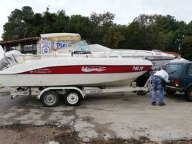 A Marinello Fisherman 19 boat is docked and being prepared for use, showcasing its sleek design and readiness for fishing adventures.