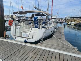 A sleek yacht named 'OPTIONS' docked at a marina, showcasing its elegant design and surroundings, perfect for sailing enthusiasts.