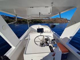 A clean and modern helm area of a boat, showcasing the steering console and seating, perfect for navigating the beautiful waters.