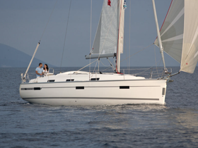 A couple enjoys a romantic moment aboard a sailing yacht, perfect for intimate getaways on the water.