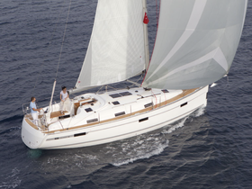 A couple enjoys sailing on a beautiful yacht, showcasing the thrill of being on the water and the joy of adventure.