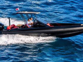 A sleek speedboat cuts through the waves with two passengers at the helm, showcasing the thrill of boating on open waters.