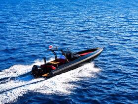 A sleek speedboat glides through the vibrant blue waters, showcasing its dynamic design and performance on the open sea.