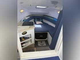 Cozy interior cabin of a boat featuring comfortable seating and a welcoming atmosphere, perfect for relaxation during trips on the water.