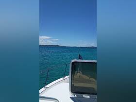 A stunning view from the bow of a boat, showcasing the vibrant turquoise waters and distant islands — perfect for a day of exploration on the open sea.