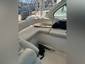 A cozy interior view of a boat's seating area, showcasing comfortable cushions and a clean, well-maintained cabin space — perfect for relaxing during a day on the water.
