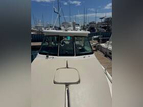 A clear view of the front deck of a yacht docked at the marina, showcasing its sleek design and surrounding boats.