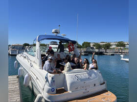 A lively group enjoys a day on the water aboard a boat in Chicago, celebrating with friends and making unforgettable memories.