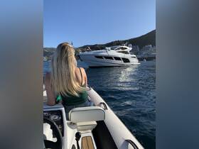 A woman enjoys a scenic view of a luxurious yacht while aboard a smaller boat, capturing the essence of a perfect day on the water.