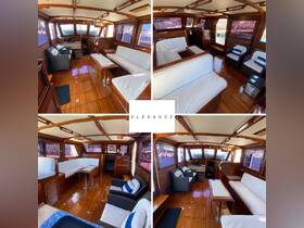 A beautifully designed interior of a boat showcasing elegant seating and a well-equipped helm area, perfect for comfortable cruising.