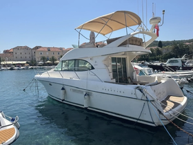 A stunning Prestige yacht docked in a picturesque harbor, showcasing its elegant design and inviting atmosphere, perfect for luxury cruising.