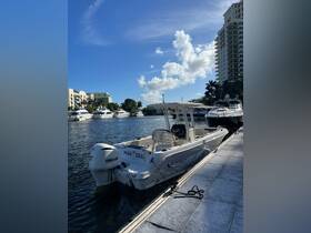 A sleek speedboat named 'MAR SEA' docked in a marina, surrounded by luxury yachts and under a clear blue sky — perfect for a day on the water.