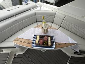 A beautifully arranged charcuterie spread with cocktails on a stylish boat seating area, perfect for entertaining guests while enjoying time on the water.