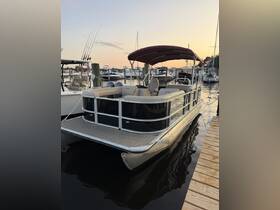 A beautiful pontoon boat docked at sunset, showcasing its spacious design and perfect for leisurely outings on the water.