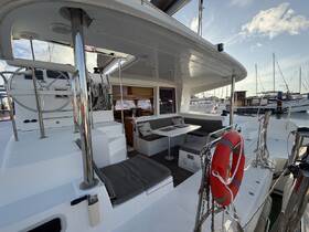 A spacious interior view of a yacht showcasing comfortable seating and a well-equipped helm area, perfect for relaxing and navigating on the water.