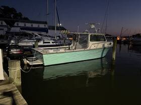A beautiful boat docked at twilight, showcasing its sleek design and vibrant colors — perfect for evening outings on the water.