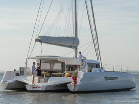 A couple enjoys a romantic moment aboard a sleek yacht, perfect for special celebrations or intimate getaways on the water.