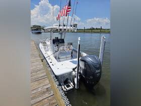 A sleek speedboat docked at the marina, showcasing its powerful Yamaha engine and equipped for a day on the water.
