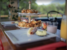 A beautifully arranged spread of snacks and desserts on a boat, perfect for enjoying refreshments while cruising on the water.