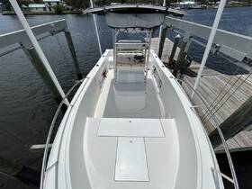 Interior view of a boat's helm and seating area, showcasing a clean and spacious design ideal for comfortable navigation and relaxation.