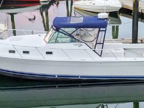 A clear side view of a docked boat, showcasing its sleek design and features, perfect for fishing or leisure outings.